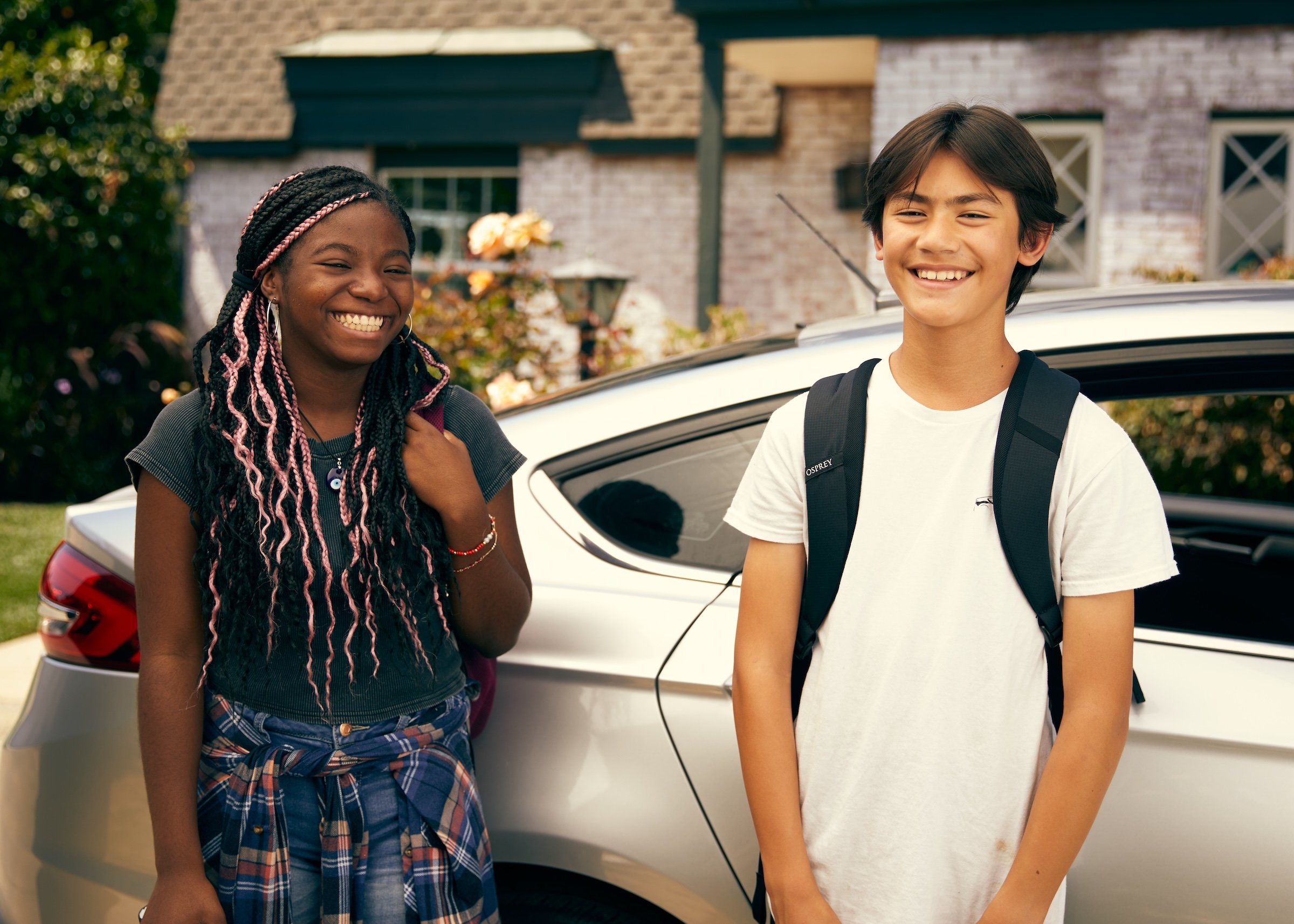 HopSkipDrive two kids by the car
